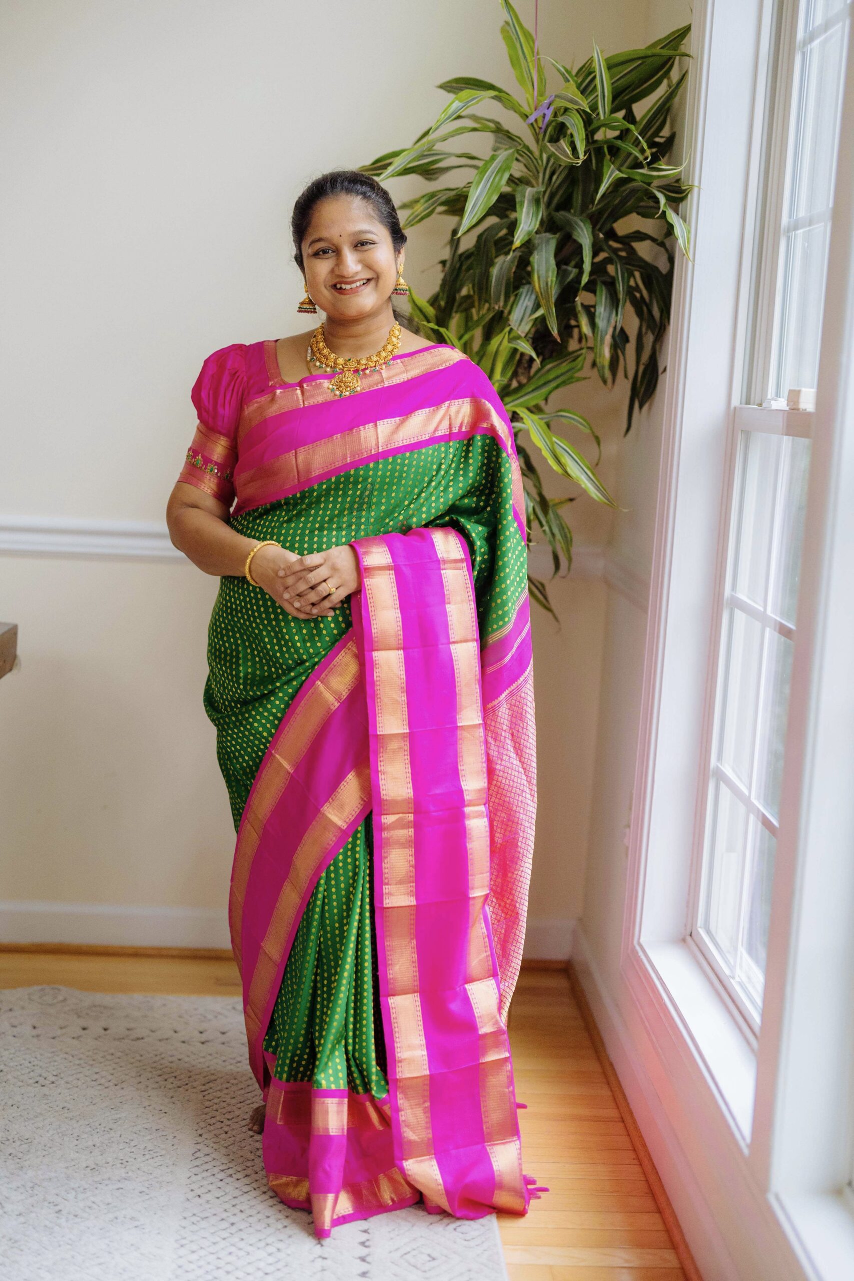 Simple Cradle Ceremony Decoration Ideas - Wearing green and pink Kanjeevaram saree With Nakshi necklace by Top US Mom Blogger Dreaming Loud