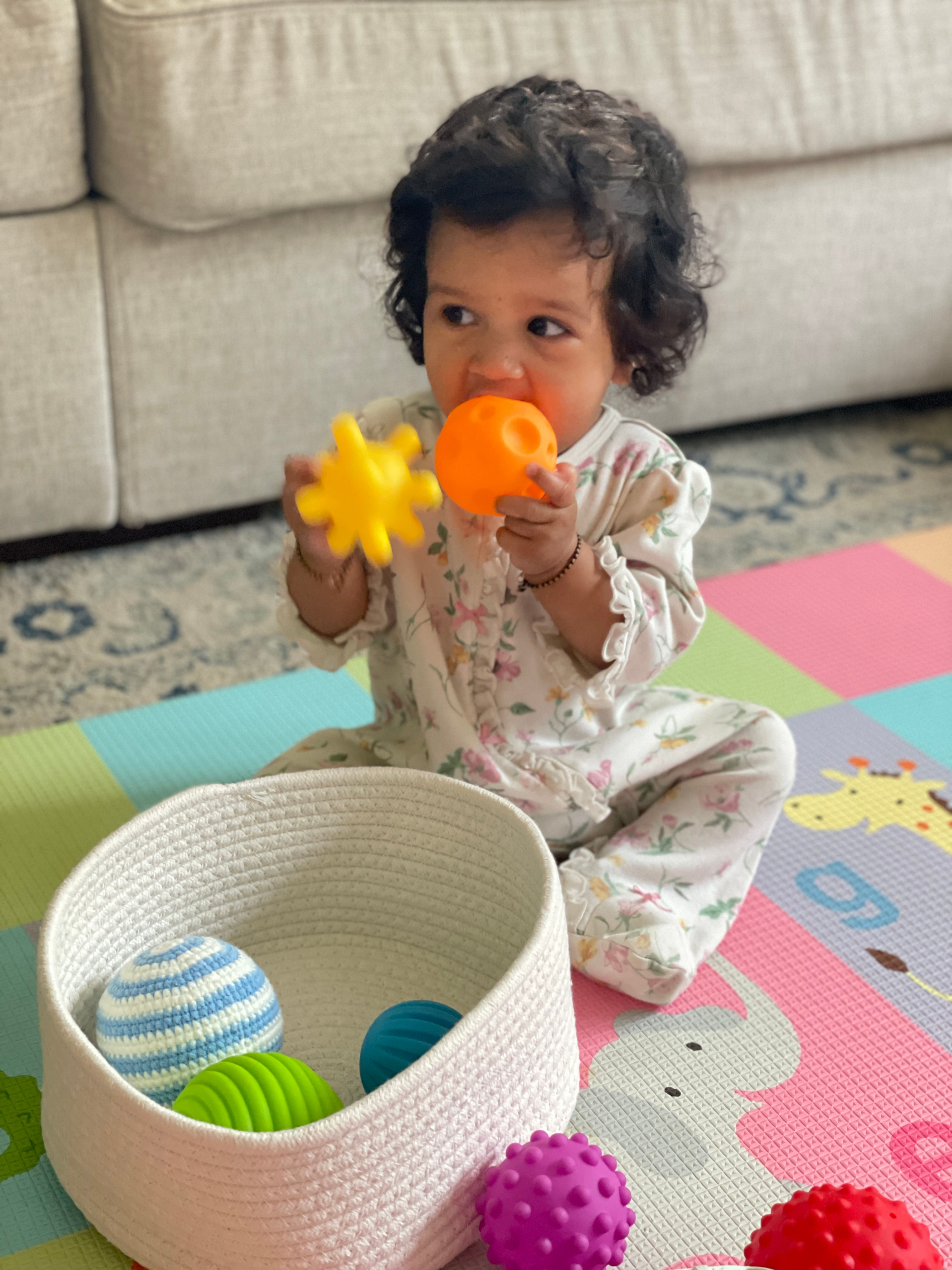 Amazing Baby Activities 6-12 Months that Boost Development through play- Sensory Balls by Top US Mom Blogger Dreaming Loud