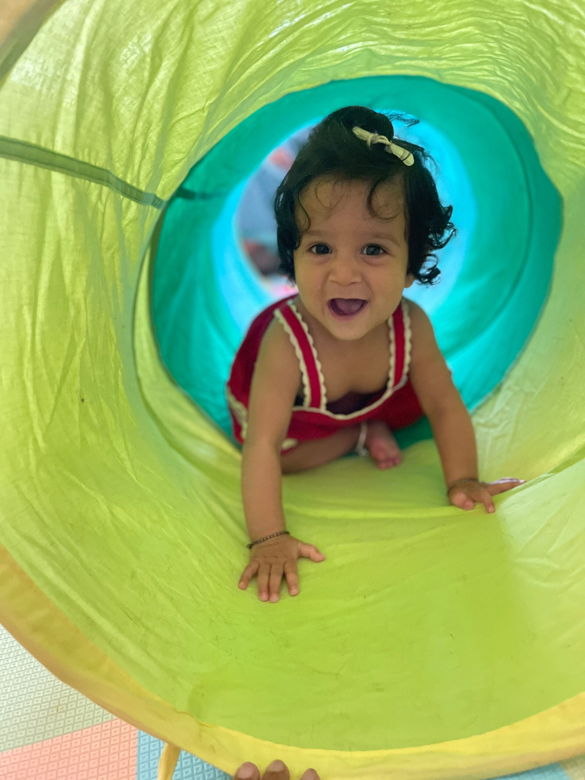 Amazing Baby Activities 6-12 Months that Boost Development through play-play tunnel by Top US Mom Blogger Dreaming Loud