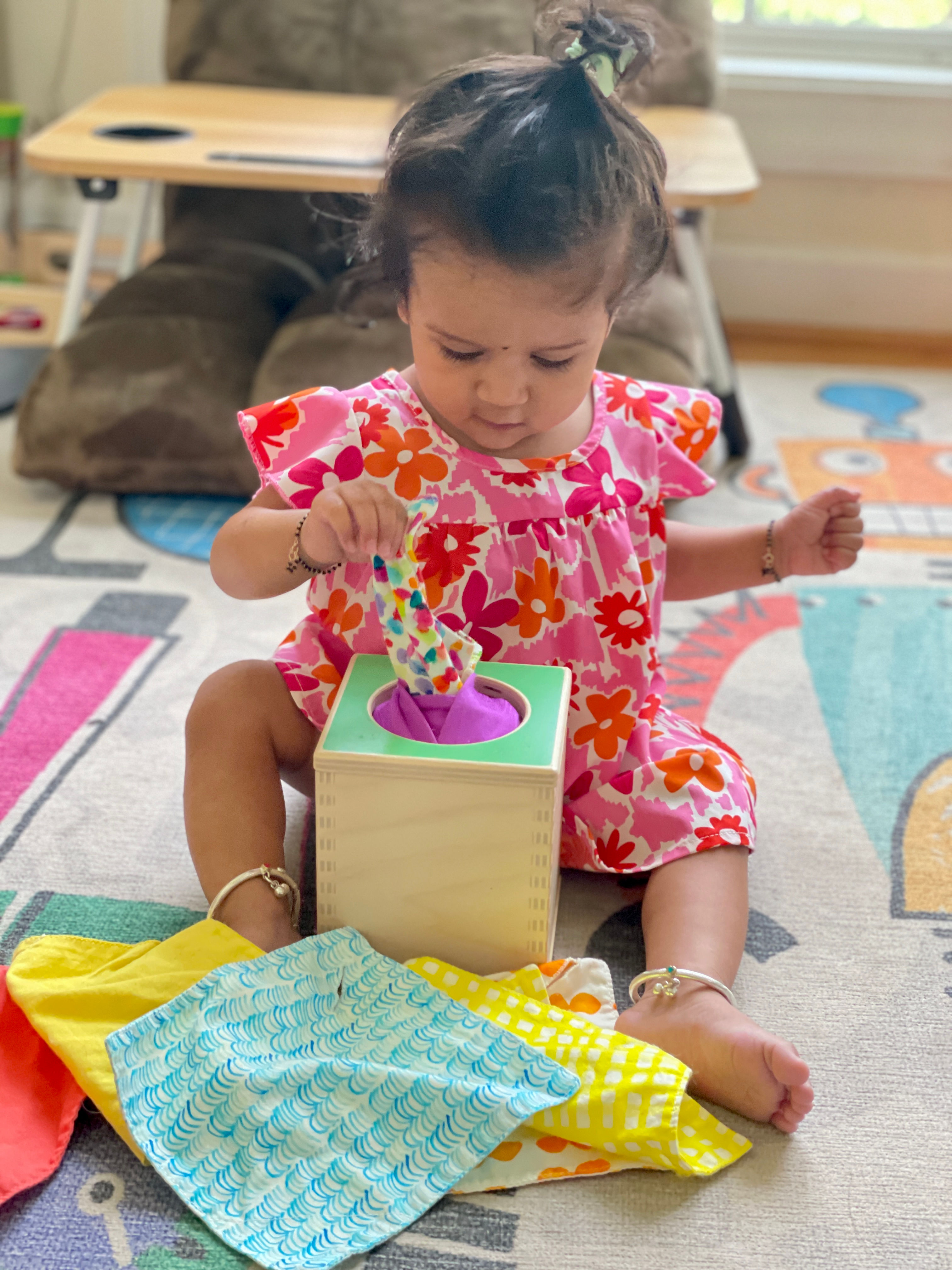 Amazing Baby Activities 6-12 Months that Boost Development through play- pulling tissue from box activity by Top US Mom Blogger Dreaming Loud